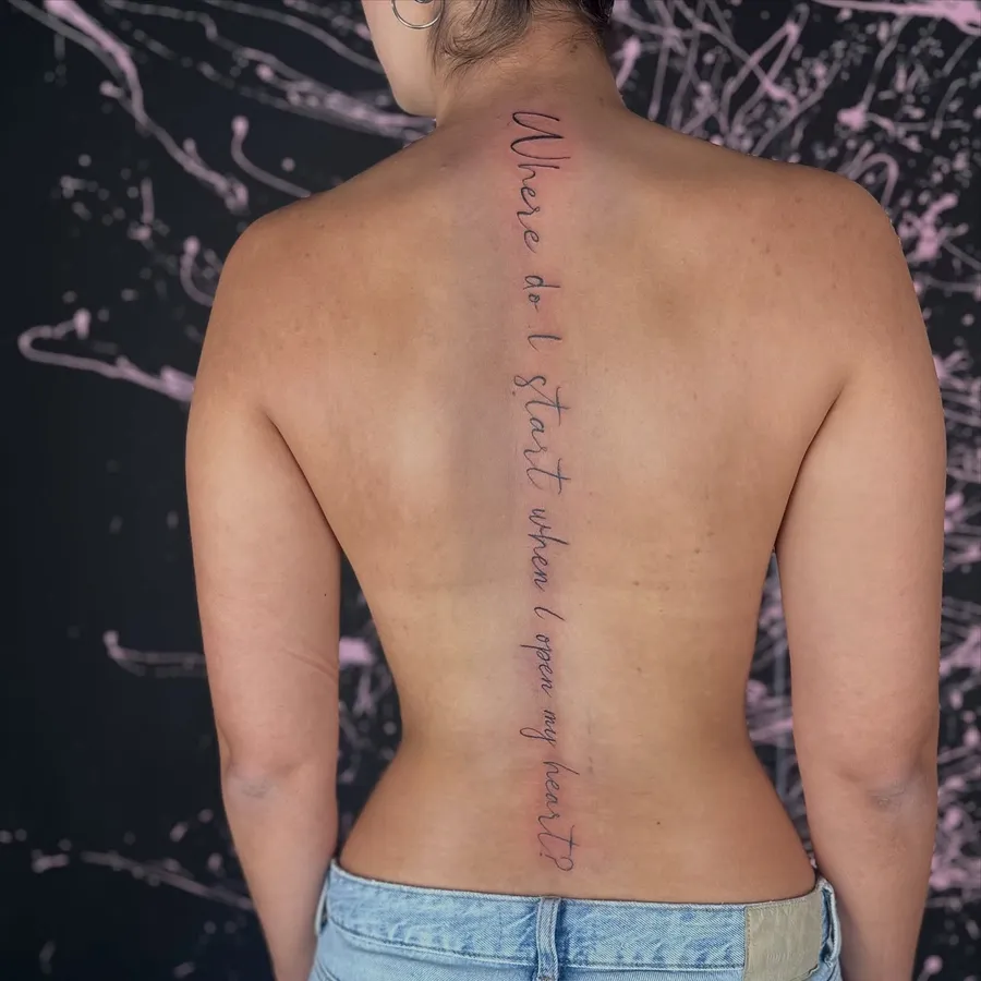Lettering τατουάζ με λεπτή καλλιγραφική γραφή στη σπονδυλική στήλη, 210 Tattoo Athens / Fine line script lettering tattoo along the spine, 210 Tattoo Athens